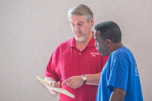 Tracey Webster of HealthMed, Inc., discusses health screening results with College Hill Baptist Church member Gary Heard.