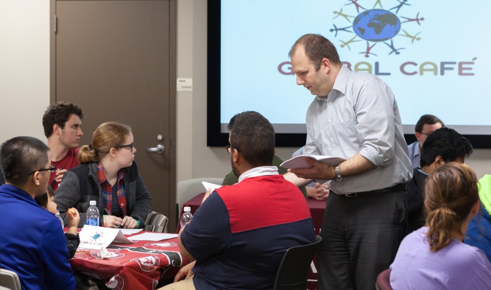 3Charter Morris, director of international services, distributes materials to help answer foreign students’ questions.