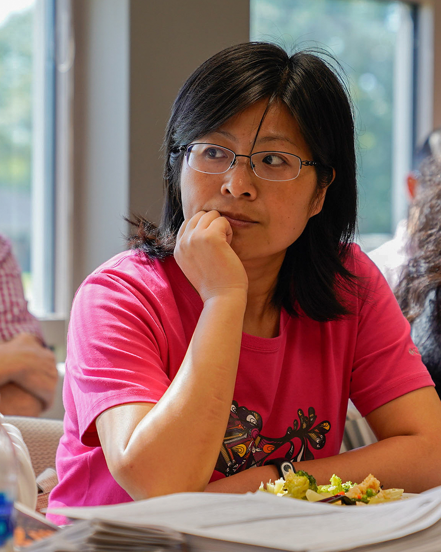 Wenjie Chai, visiting scholar in Social Work, listens to presentation at the October 12 Global Cafe meeting.