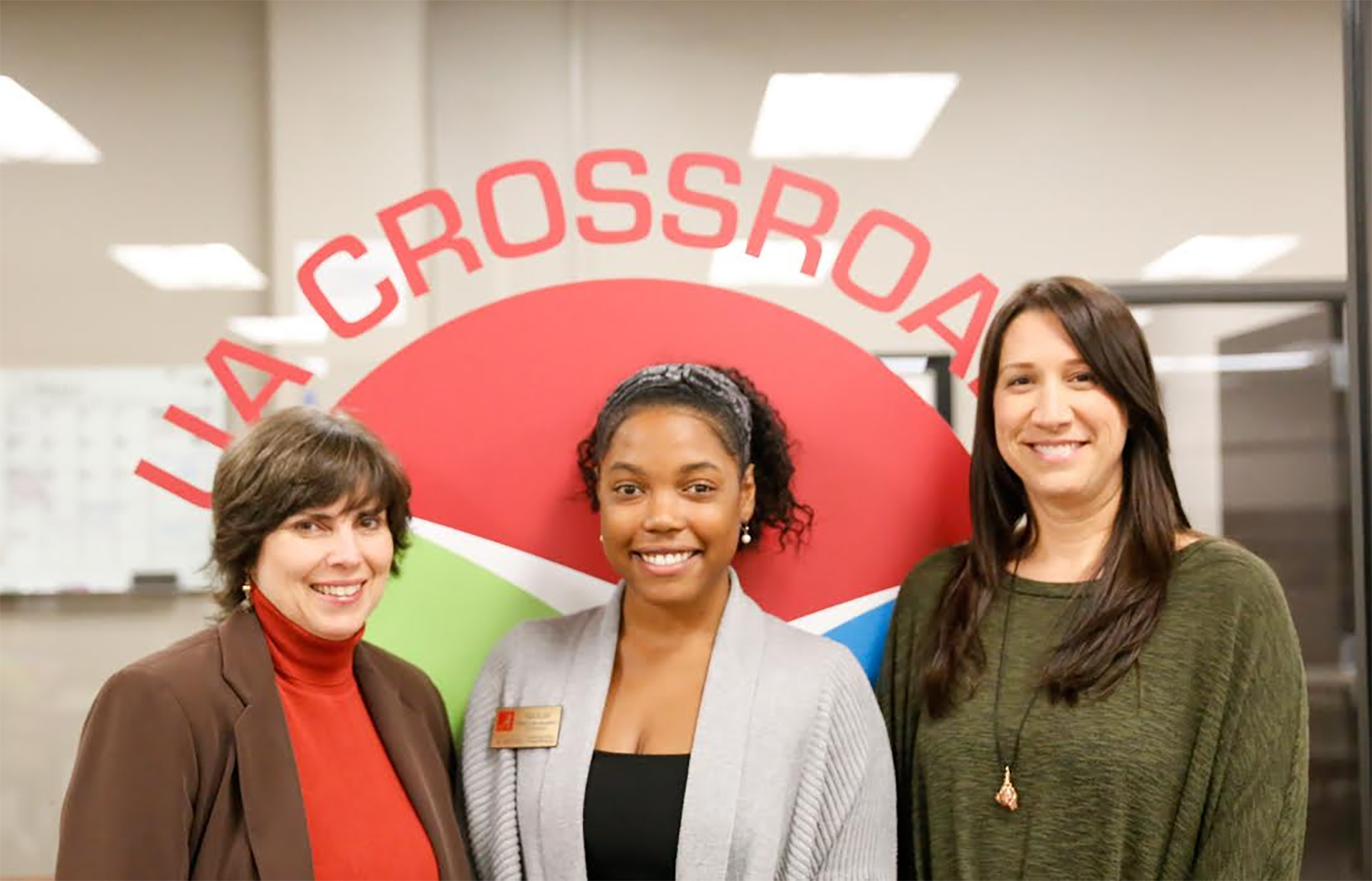 From left, Lane McLelland, Paige Bolden and Betsy Myers represent Crossroads Community Engagement Center on receiving the Sam S. May Award in October.