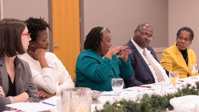 Dr. Pamela Payne Foster, center, makes a point about the design of a new Saving Lives Academy during the final Saving Lives meeting of 2017.
