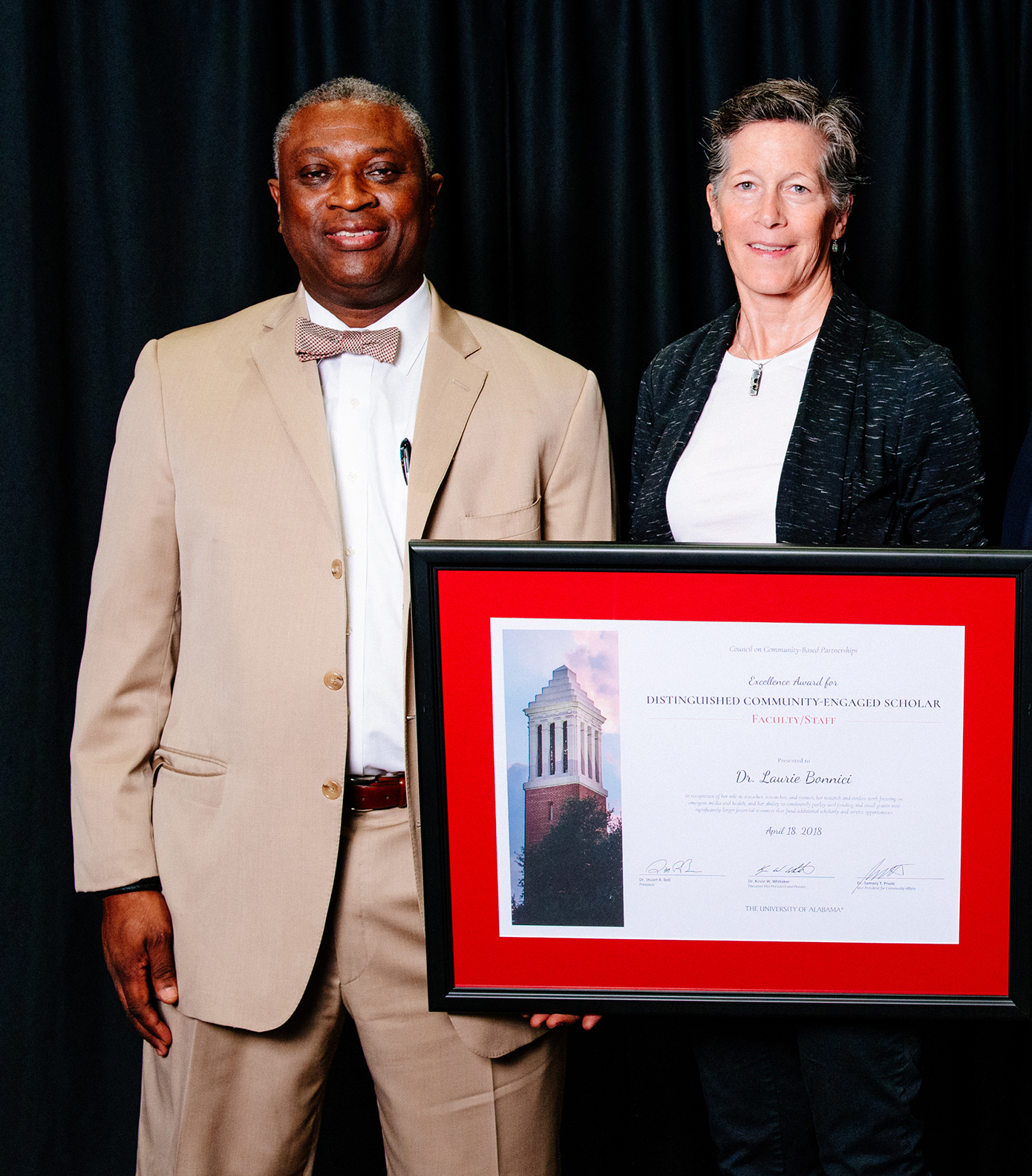 Dr. Laurie Bonnici, with Dr. Samory T. Pruitt receives the Distinguished Community-Engaged Scholar Award–Faculty.