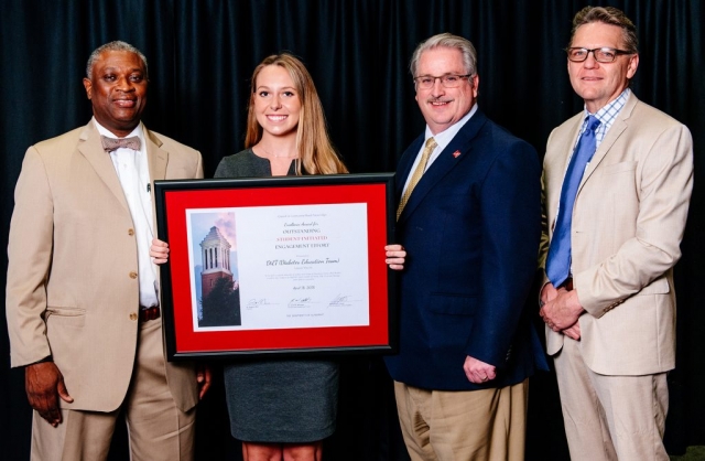 The Excellence Award for Outstanding Student-Initiated Engagement Effort recipient Lauren Martin, with Dr. Samory T. Pruitt, Dr. John Higginbotham and Dr. Peter Hlebowitsh.