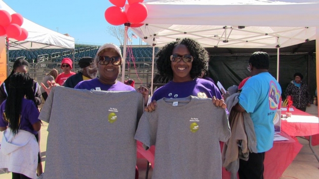 Carol Agomo and Annette Harris show off the T-shirts they won for completing the Brussels sprout challenge at Heart Walk 2018.