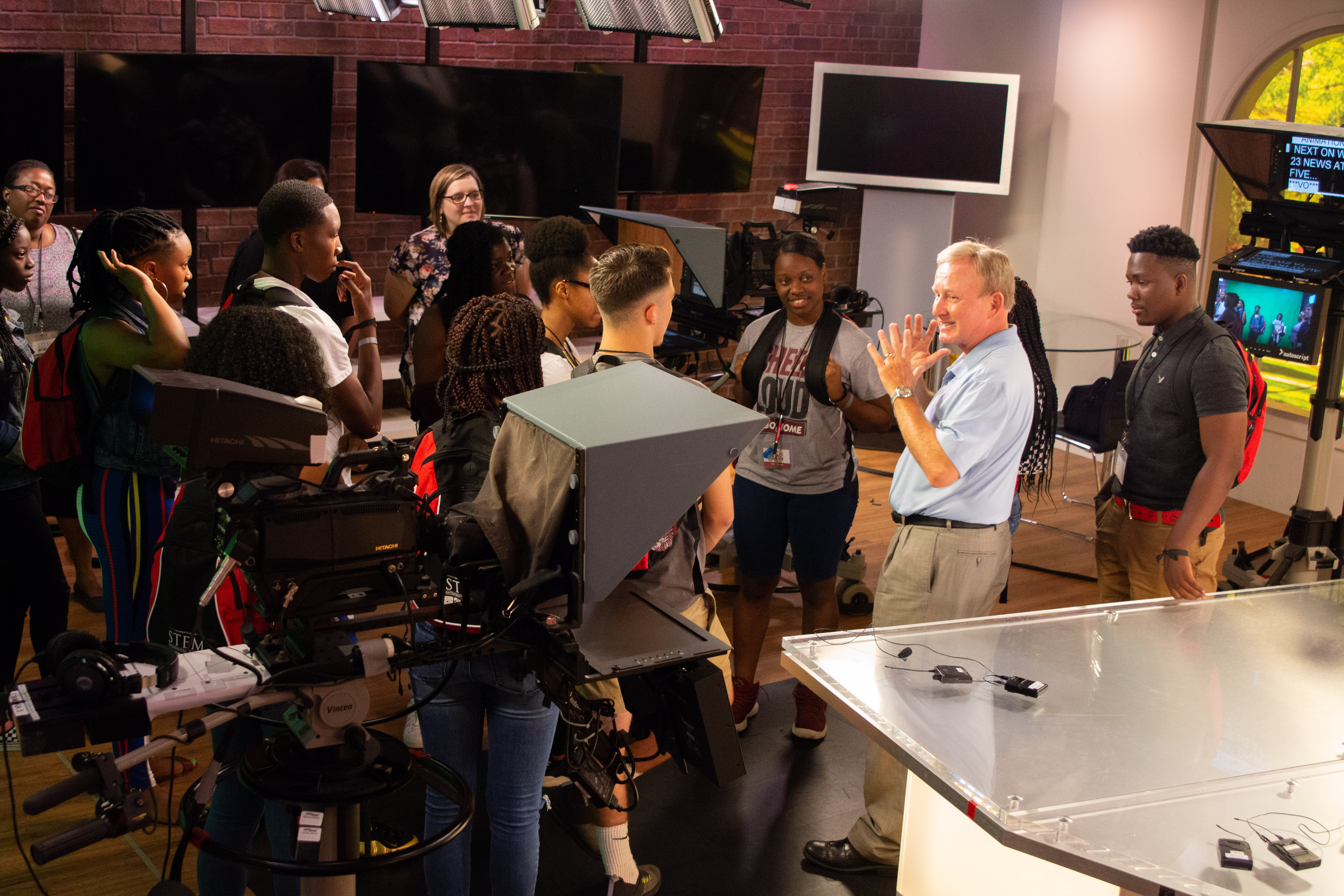 STEM Academy participants tour the WVUA studio and meet longtime newscaster Mike Royer, who now serves as managing editor at the studio, where he shares a lifetime of broadcast journalism experience and encouragement with students.