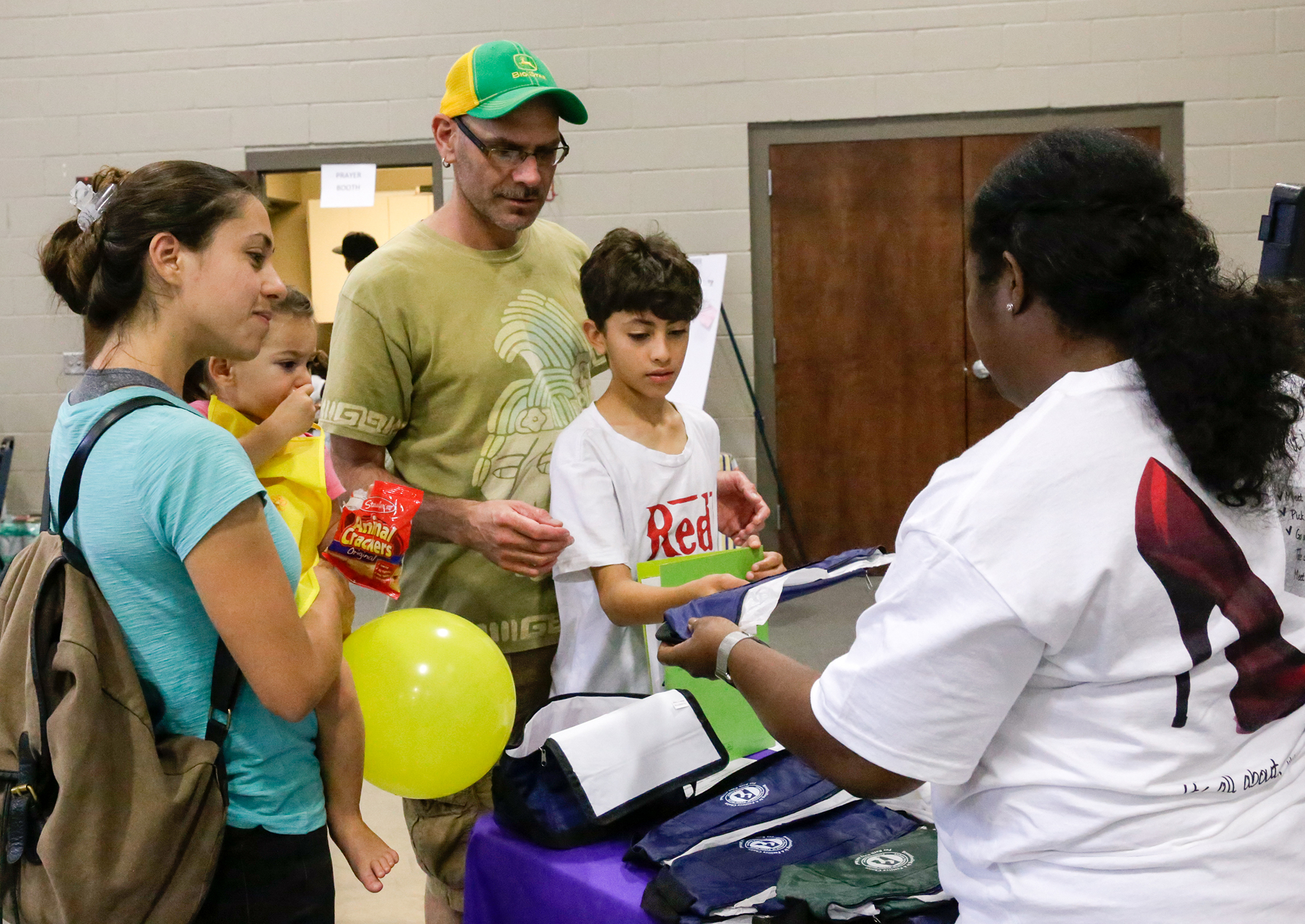 A family receives nutrition information from Trendle Samuel, Region II perinatal coordinator with the Alabama Department of Public Health.