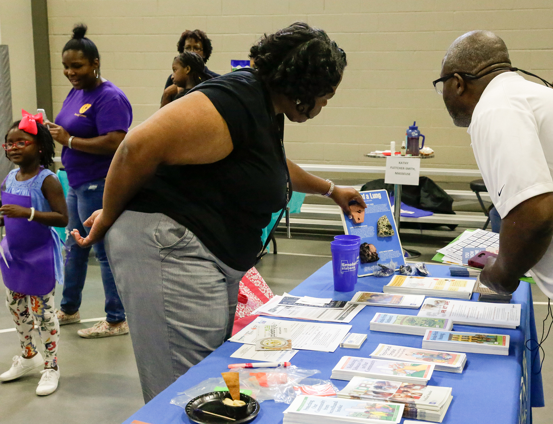 Fayetta Royal, a tobacco prevention and control coordinator with the Alabama Department of Public Health, explains a lung display.