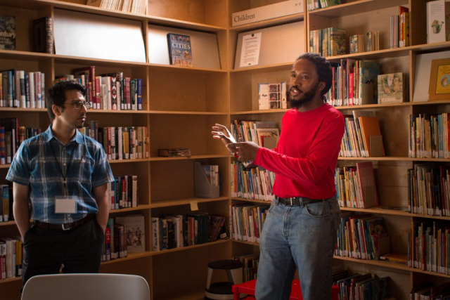 Caleb (red shirt), a Rural Studio student, conducted the tour of the Newbern Library.
