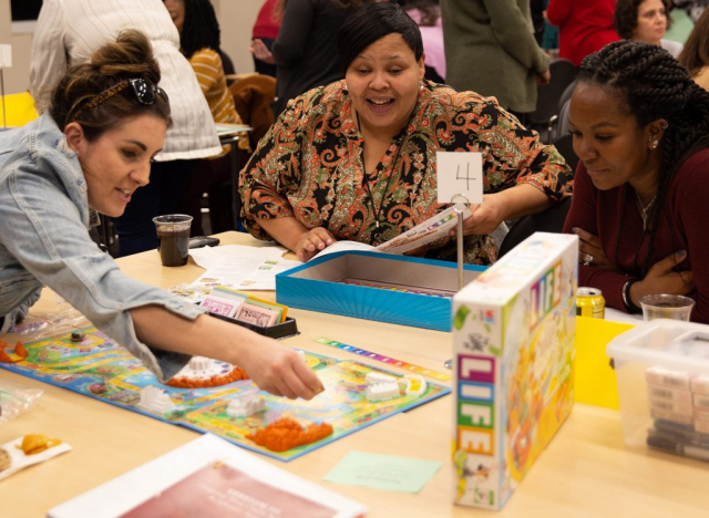 Parents try their hand at math games during the "Math Matters" session.