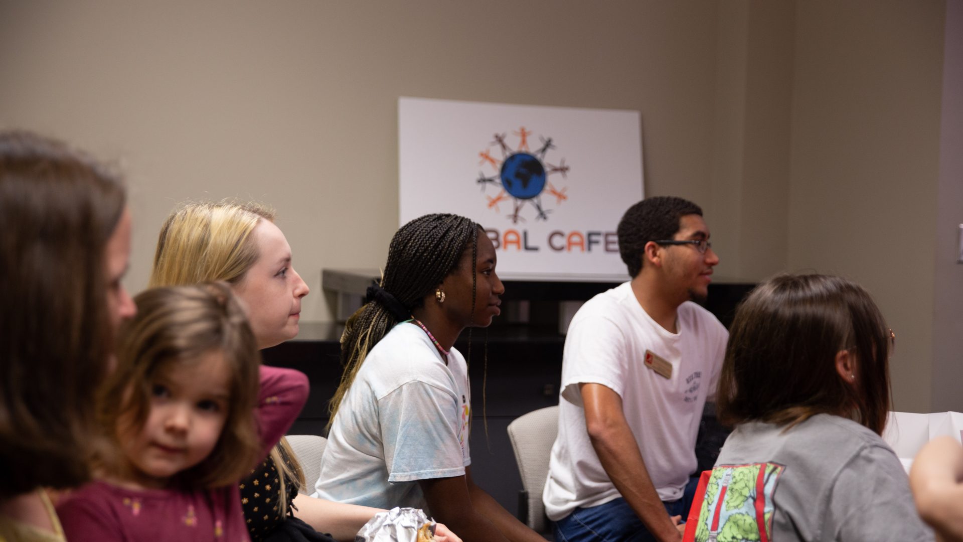 Students looking at someone speaking