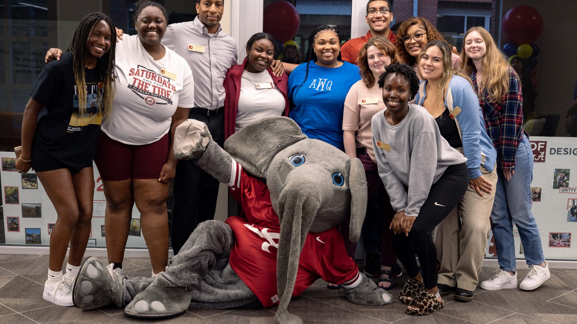 People posing with the mascot, Big Al