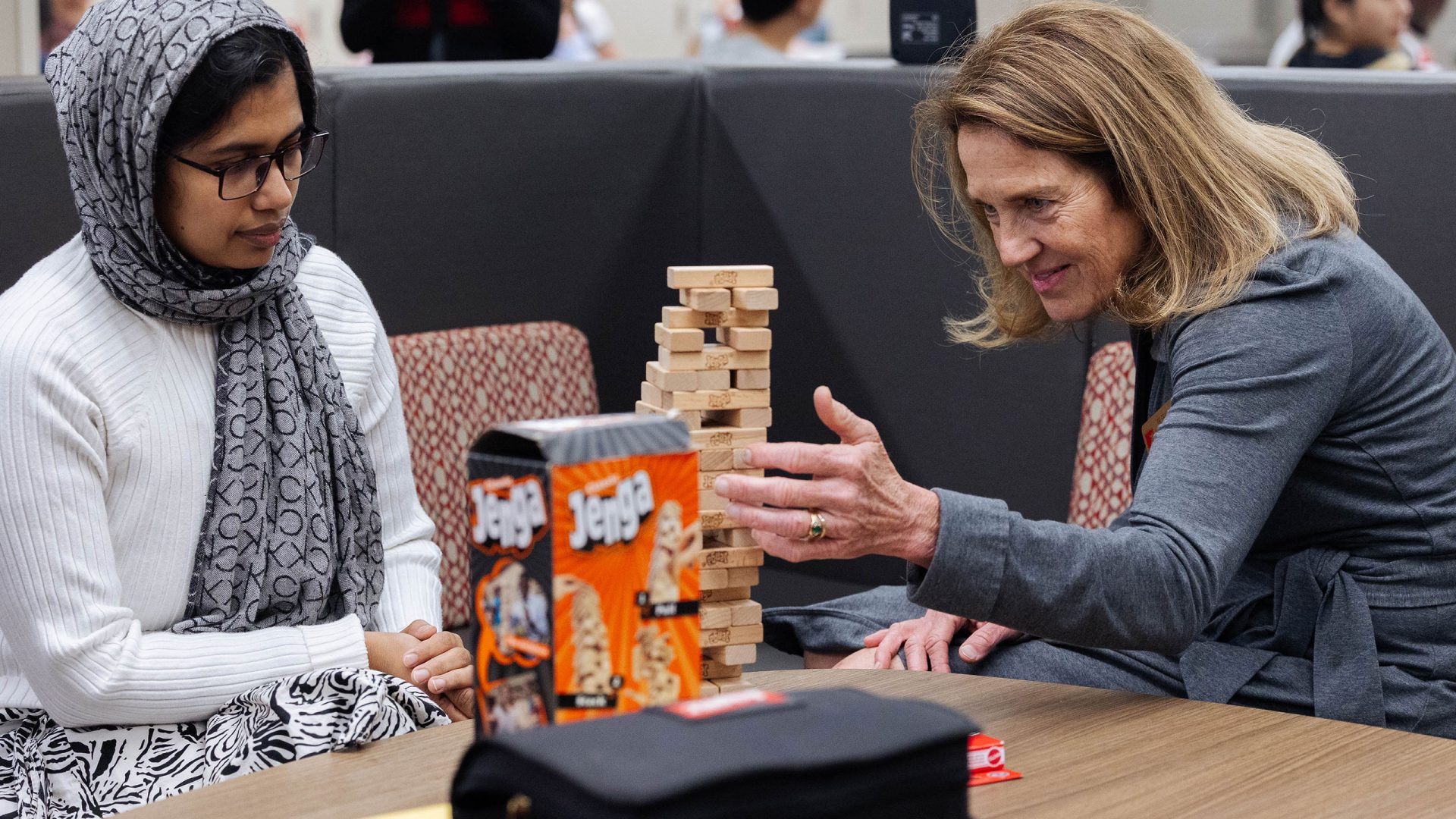 A member of the international community and director Fran Oneal play Jenna