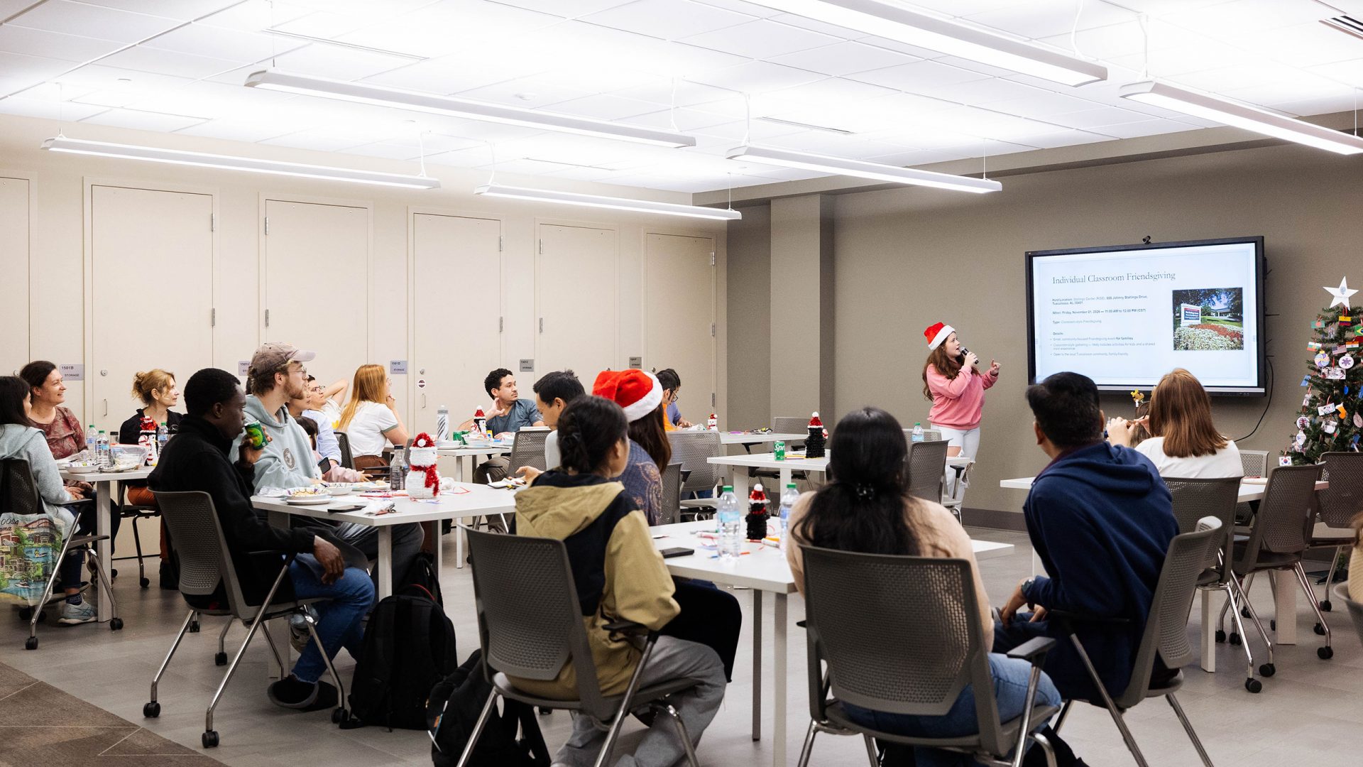 Students seated at tables at a Global Café event