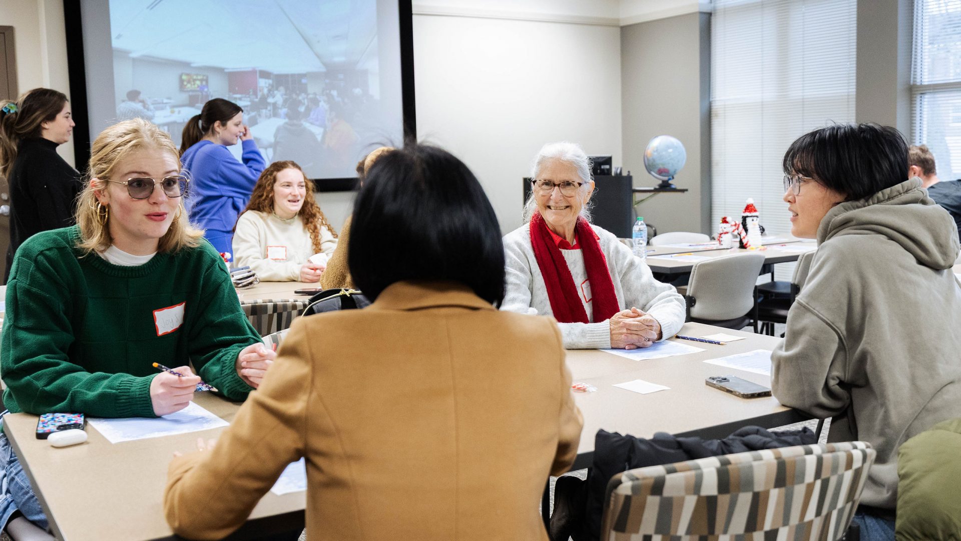 Participants at a Global Café event participate in an icebreaker activity