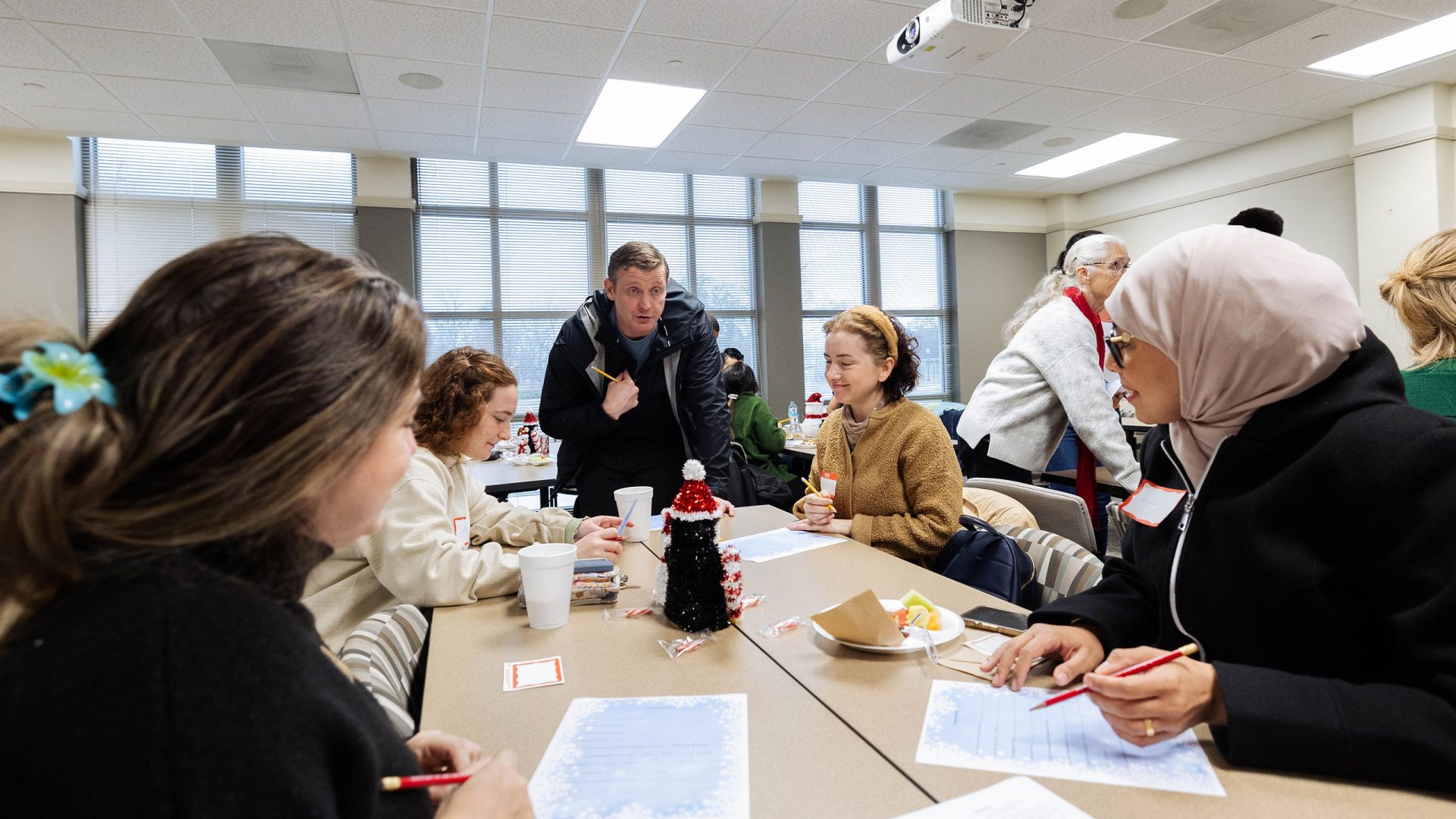 Participants at a Global Café event participate in an icebreaker activity