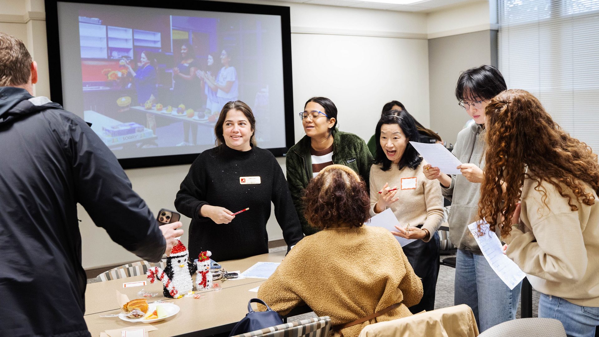 Participants at a Global Café event participate in an icebreaker activity