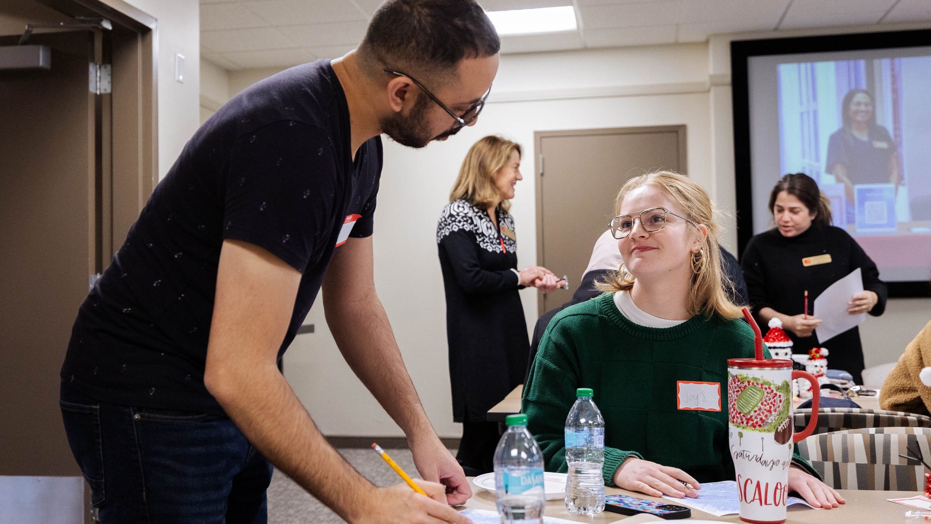 Participants at a Global Café event participate in an icebreaker activity